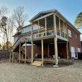 Replacing Damaged Boards: Improve Your Outdoor Living Space with Deck and Roof Renovations
