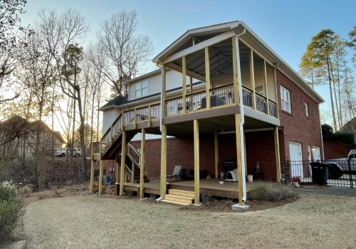 Replacing Damaged Boards: Improve Your Outdoor Living Space with Deck and Roof Renovations